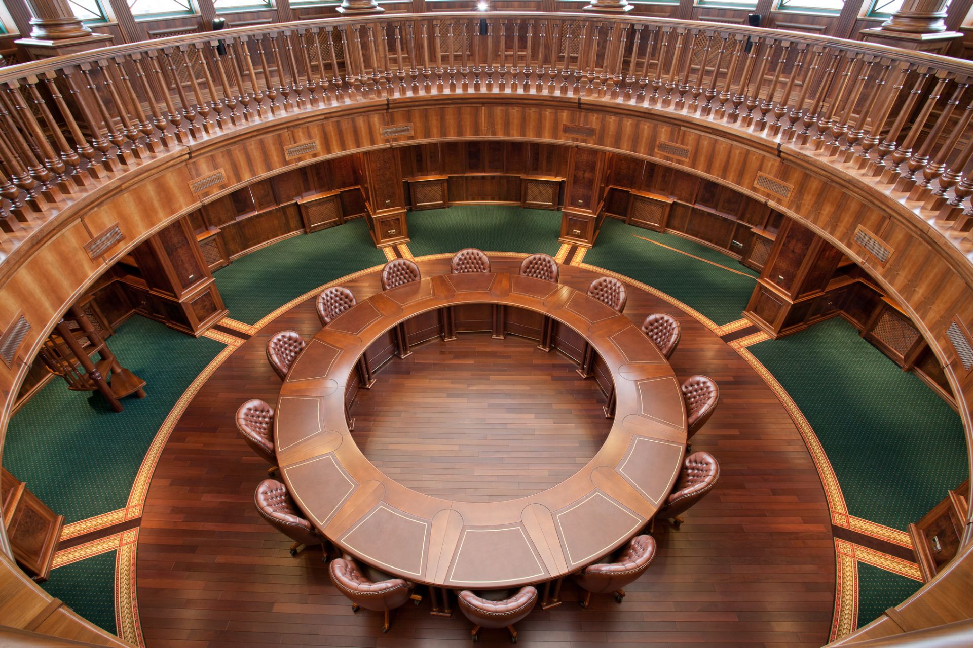 Wooden round table in the library of Arcada Bank