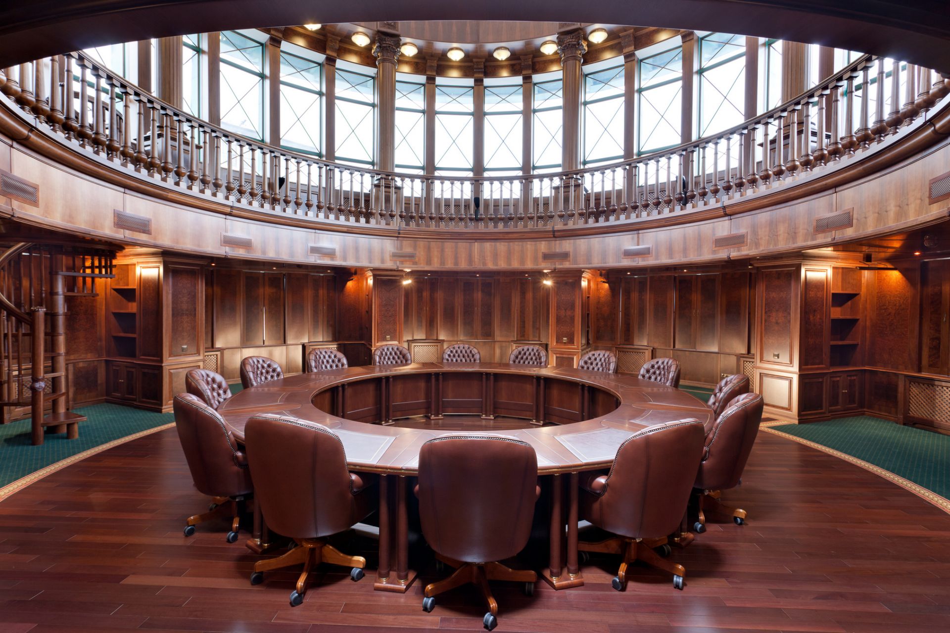 Wooden round table in the library of Arcada Bank